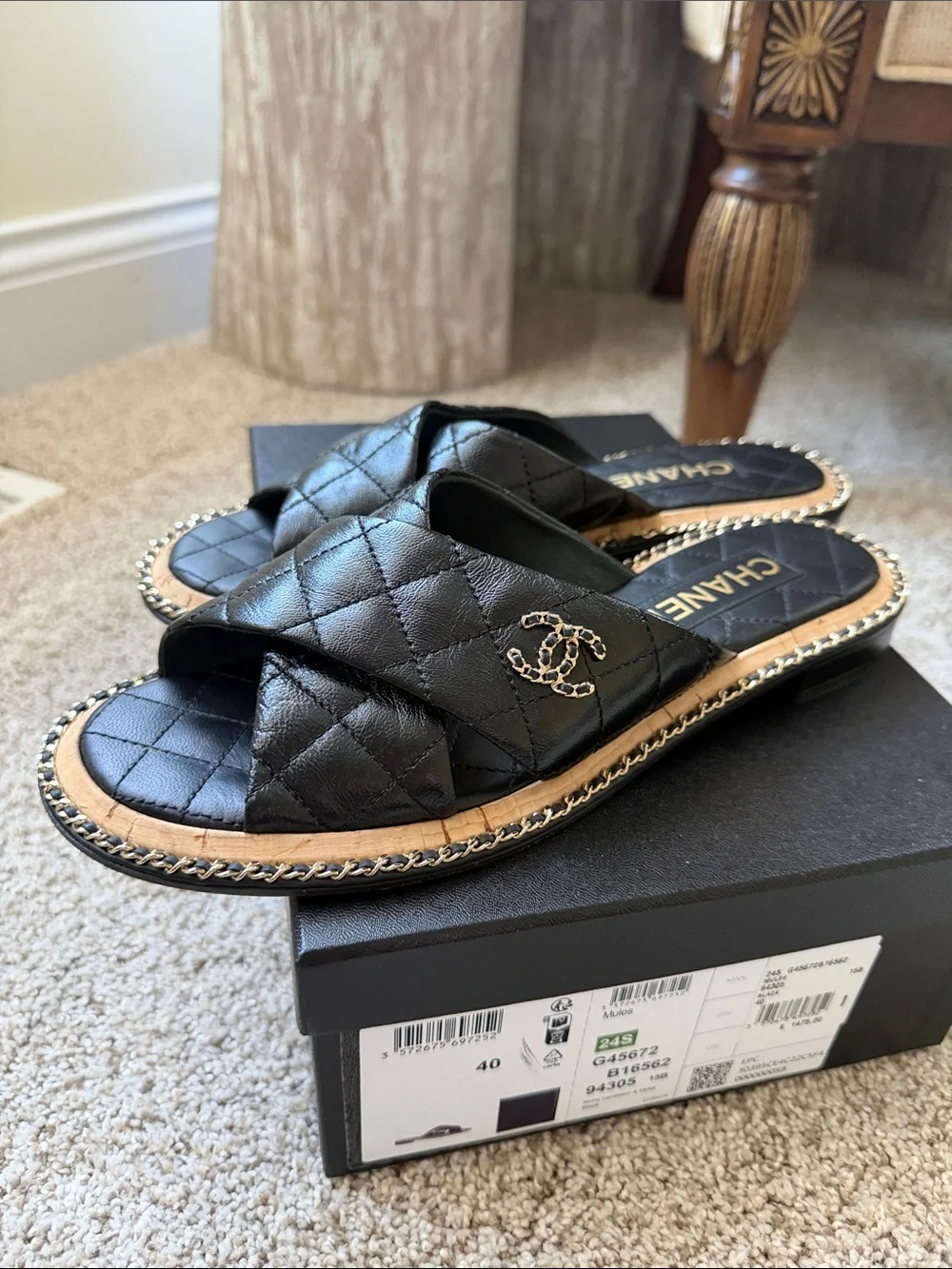 CHANEL Black Quilted Leather Crisscross Slide Mules with Chain Accent